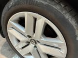 a close up view of a tire on a car