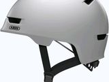 an image of a white helmet with black buttons on the side