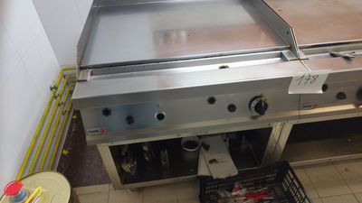 an image of a commercial gas grill in a commercial kitchen