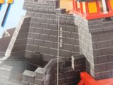 a picture of a toy castle with a red tower