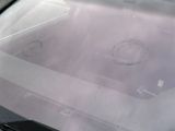 a picture of a car ' s windshield with a hole in it