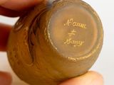 a person holding a bottle that has writing on it