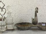 a silver plate and a silver bowl on a table