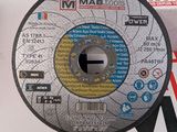 a picture of a metal grinding disc on a table