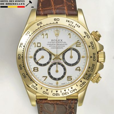 an image of a rolex watch with a white dial and brown leather strap