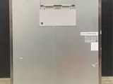 an image of a stainless steel freezer in a warehouse