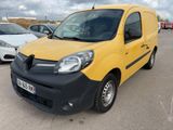the yellow van is parked in a parking lot with other cars