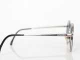 a close up of a pair of glasses on a white surface