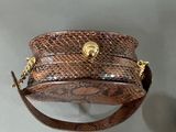 brown snake skin purse with gold hardware and chain strap