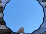 a person taking a picture of themselves in a mirror