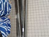 a pile of tools on the floor next to a pile of bags