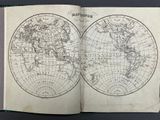 an open book with a map of the world on it