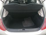 the back of a car with the trunk open and the seat folded down