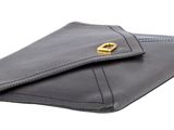 a close up of a wallet with a gold clasp on it
