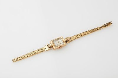 an image of a gold watch on a white background