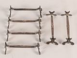 several pieces of metal are arranged on a white surface