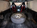 a truck that has a tire in the back of it