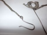 a metal hook with a chain attached to it