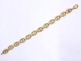 a close up of a gold bracelet on a white background