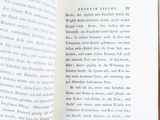 an open book that has a picture of a cat on it