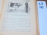 un livre sur lequel figure l'image d'une vache et d'un homme debout à côté d'elle