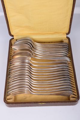a lot of spoons in a case on the table