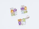 un ensemble de trois pierres précieuses multicolores sur fond blanc