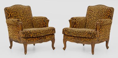 pair of leopard print armchairs with turned legs
