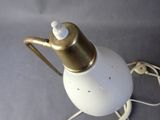 a lamp that is on a table with a cord