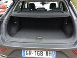 the back of a car with its trunk open in a parking lot