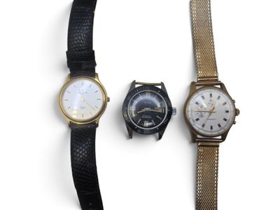 three different types of watches are displayed on a white surface