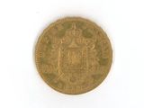 une vieille pièce d'or sur laquelle figure un blason