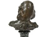bronze bust of a man on a marble base on a white background