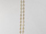a gold necklace with a chain that has a circular design on it