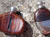 two bottles that are sitting on the ground