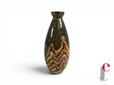 a brown and black vase sitting on a white surface