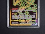 the pokemon trading card is in a plastic case
