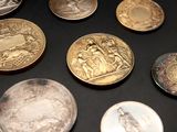 a lot of coins that are sitting on a table