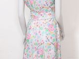 a mannequin wearing a dress with a floral pattern on it
