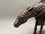 a statue of a horse that is standing on a table