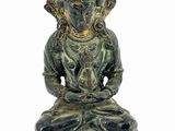 an image of a statue of a person sitting in a lotus position