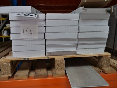 a stack of boxes on a pallet in a warehouse