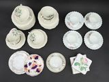many different types of china dishes and cups on the table
