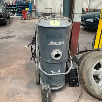 an image of a machine that is in a garage