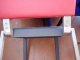 a close up of a pink seat on a chair