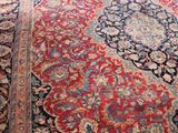 a large oriental rug on the floor in a living room