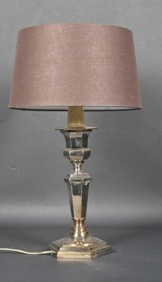 a lamp that is sitting on a table next to a lamp