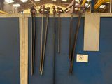 a blue wall with a bunch of tools hanging on it