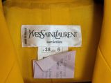 a close up of a yellow jacket with a label on it