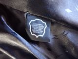 a close up of a label on a black shirt